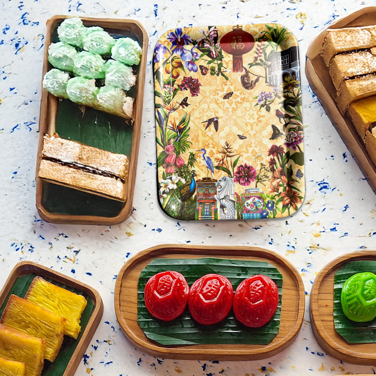Kelly Ser eco-friendly bamboo tray serving kuehs and snacks featuring black and white bungalow artwork and peranakan tiles