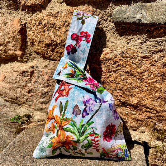 Fine art Japanese knot bag featuring hand-painted Merlion, Vanda Miss Joaquim, and Nyonya teapot