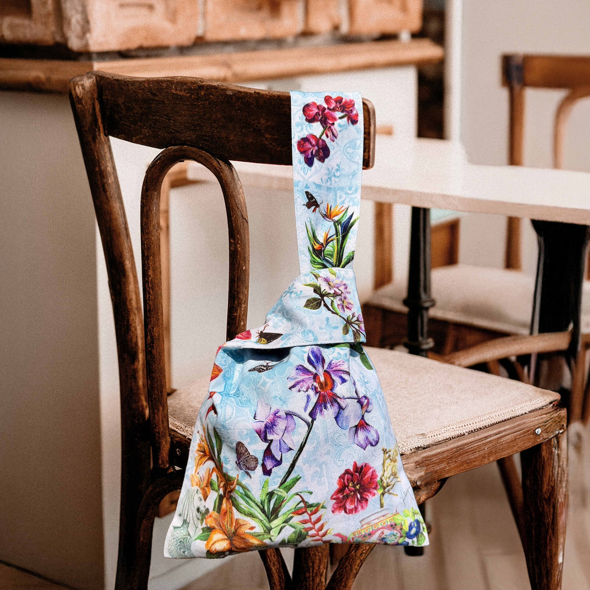 Close-up of native Singapore flora art on fabric knot bag